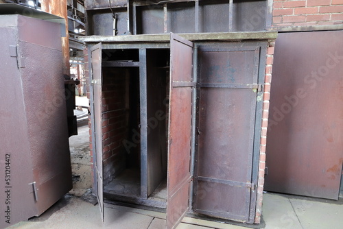 an old rusty open metal cupboard
