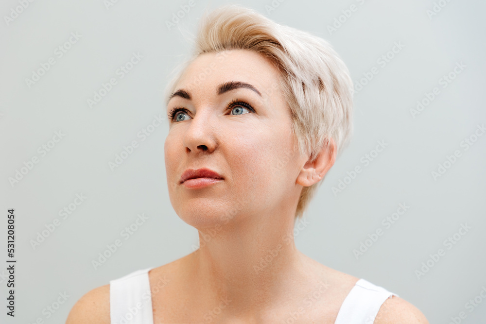 Portrait of an adult confident beautiful woman with blonde hair. The concept of psychology and business Portrait of an adult confident beautiful woman with blonde hair. The concept of psychology and business