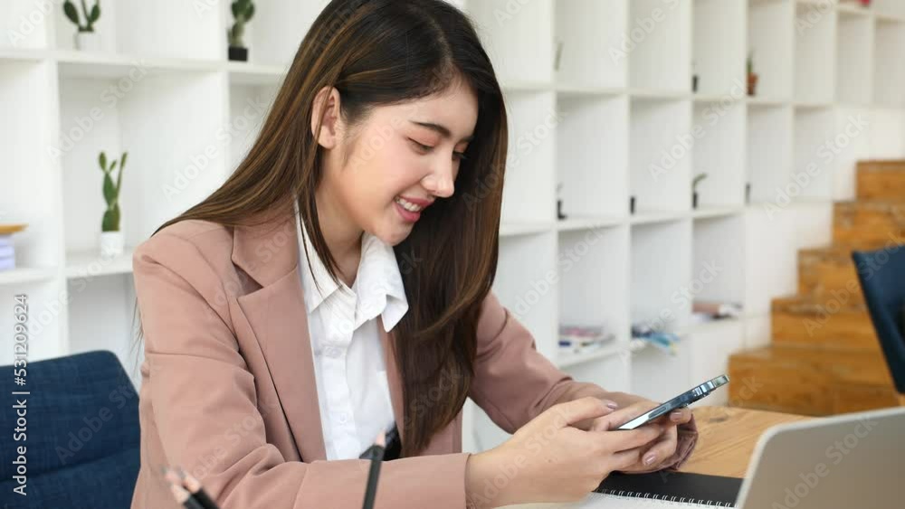 Asian businesswoman chatting with customers via laptop online