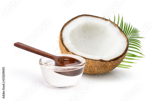 Cold pressed extra virgin coconut oil in glass bowl isolated on white background. 