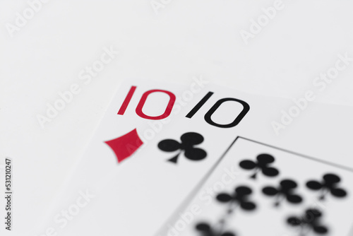 Playing cards two tens on white