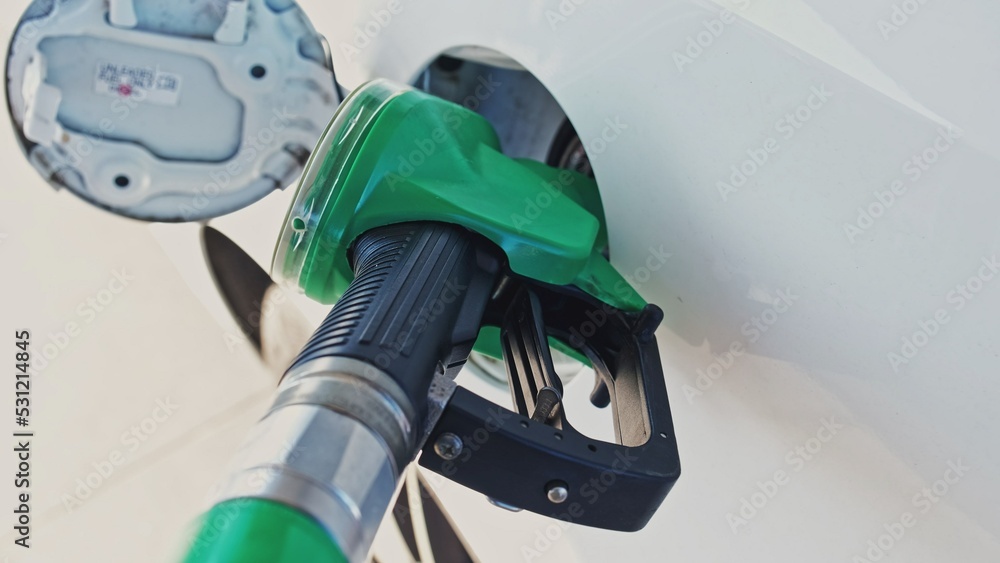 Gas Station Fuel Gasoline Pump Nozzle Pistol Inserted into Car Tank Filler Hatch Parallax Gas Station Fuel Gasoline Pump Nozzle Pistol Inserted into Car Tank Filler Hatch Parallax