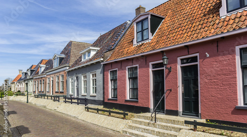 Colorful traditional houses in the small village Holwerd, Netherlands, Netherlands