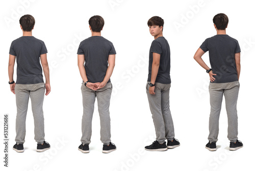 back view of same teen in sportswear turned and looking at camera on white background