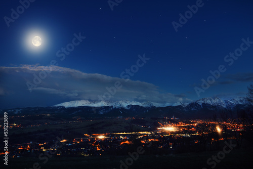 view of the Zakopane city and Polish Tatra Mountains at night