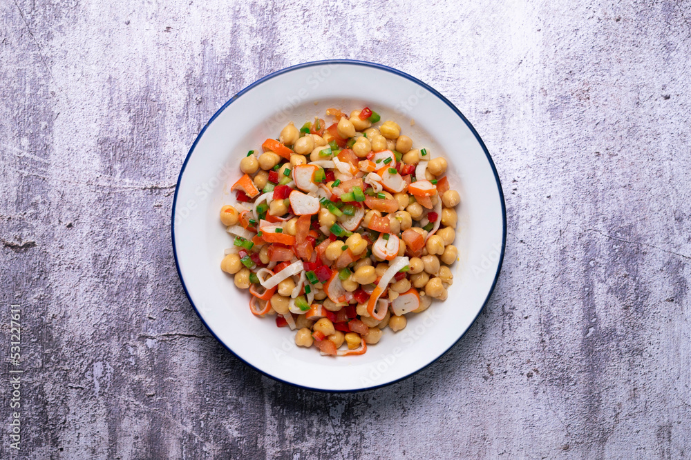 Chickpea salad with crab and vegetables. Cold salad typical Spanish cuisine. Chickpea salad with crab and vegetables. Cold salad typical Spanish cuisine.