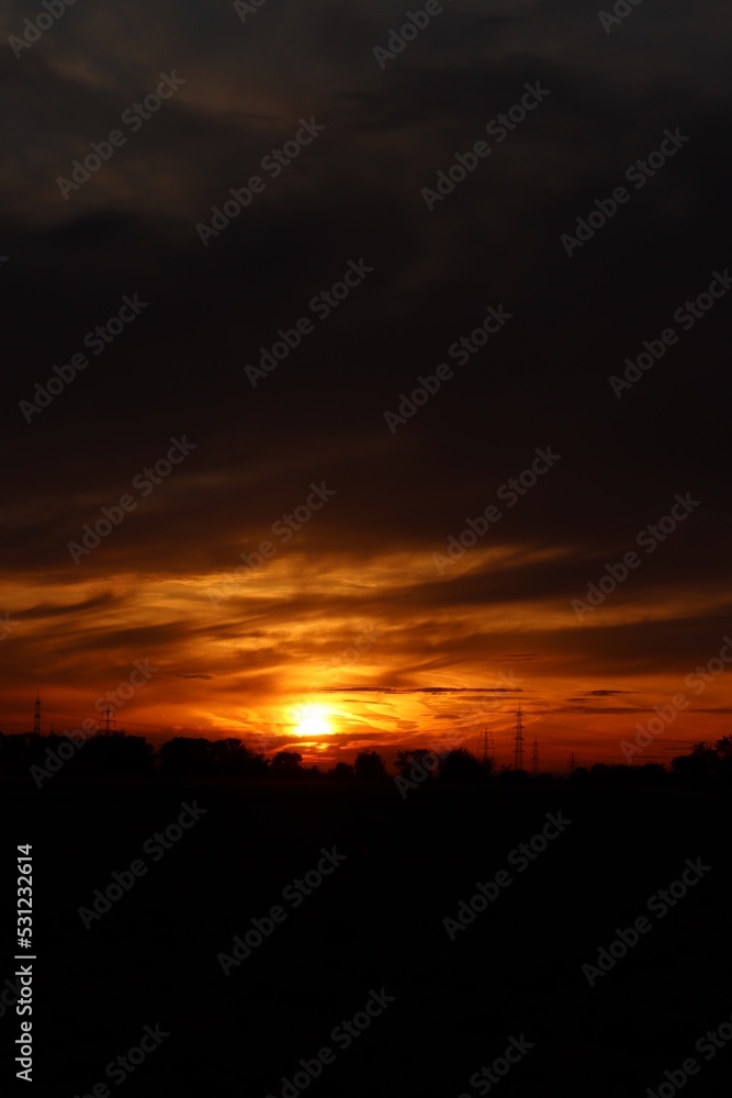 Beautiful sunset with orange and yellow clouds