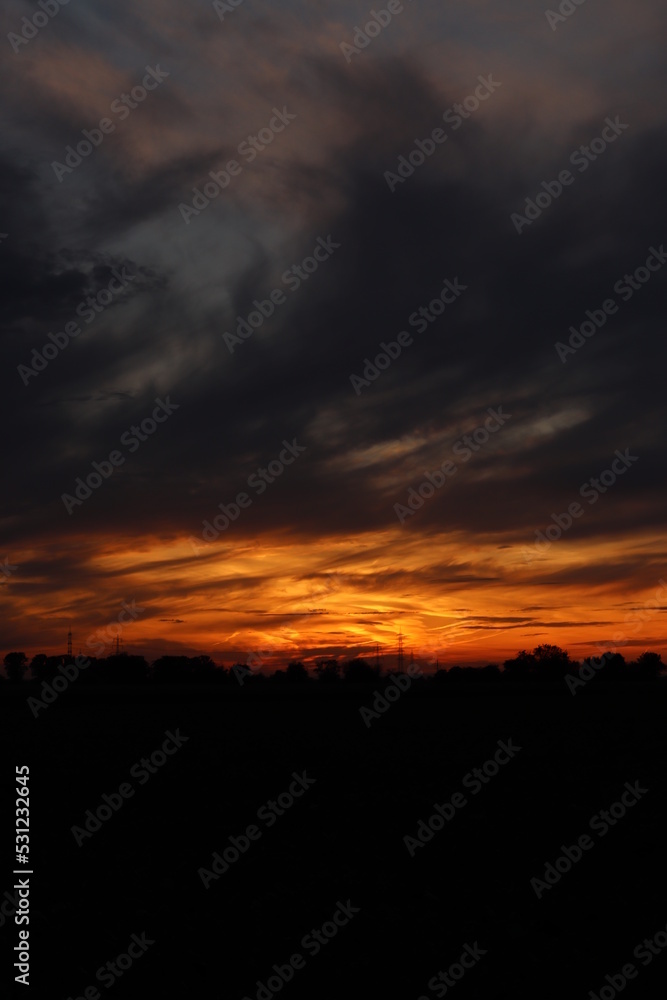 Beautiful sunset with orange and yellow clouds