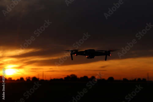 Drone in the foreground and sunset in the background