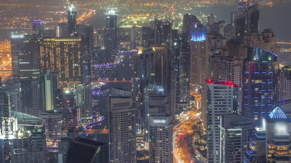 Skyline view of Dubai Marina showing canal surrounded by skyscrapers along shoreline all night timelapse. DUBAI, UAE Skyline view of Dubai Marina showing canal surrounded by skyscrapers along shoreline all night timelapse. DUBAI, UAE