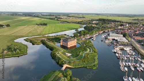 Muiderslot medieval stronghold castle restored heritage culture monument for touristic museum purpose. Aerial overhead view. Dutch The Netherlands, Holland, fortification landmark full of history. photo