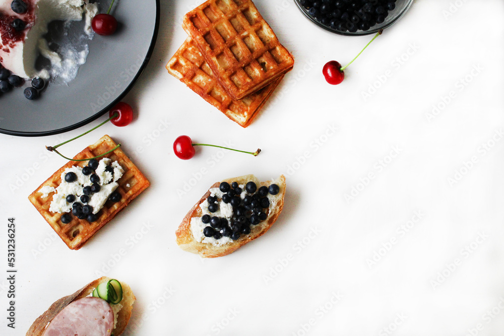 still life top view breakfast of Belgian waffle cheese and berries on a plate. Healthy delicious proper breakfast. Healthy food still life top view breakfast of Belgian waffle cheese and berries on a plate. Healthy delicious proper breakfast. Healthy food
