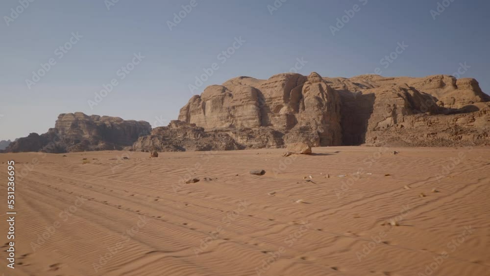 A journey in the planet Mars like landscape of Wadi Rum desert, a valley of red sand cut into the sandstone and granite rock in southern Jordan A journey in the planet Mars like landscape of Wadi Rum desert, a valley of red sand cut into the sandstone and granite rock in southern Jordan