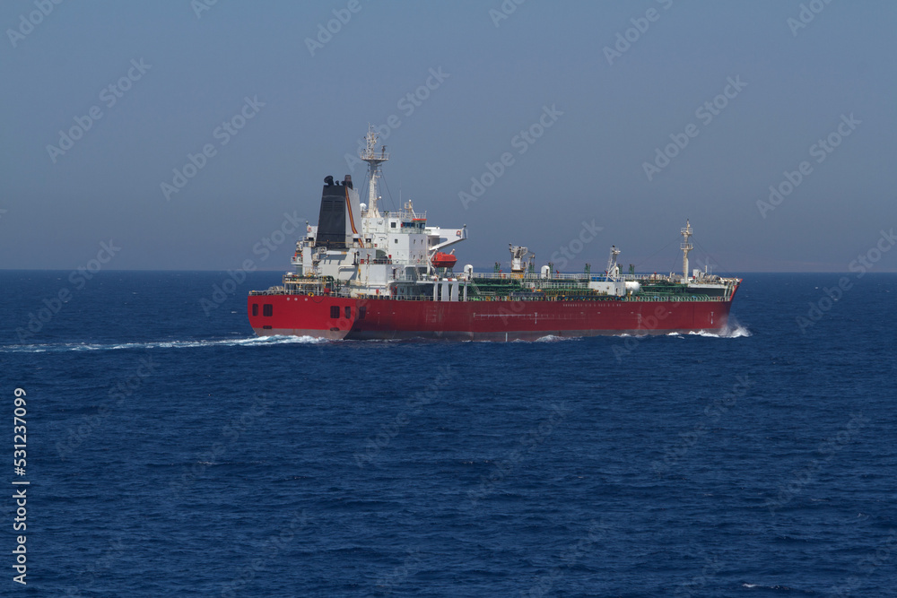 A merchant ship underway at sea in calm weather