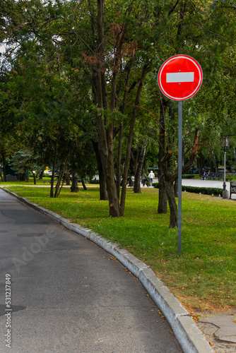 Traffic red sign with white rectangle Entry is prohibited, road with road sign prohibition