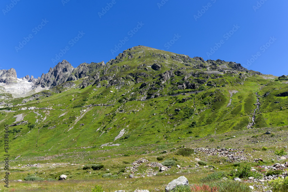 Obraz premium Beautiful aerial view over Gadmer Valley, Canton Bern, at Swiss mountain pass on a sunny summer day. Photo taken July 13th, 2022, Susten Pass, Switzerland.