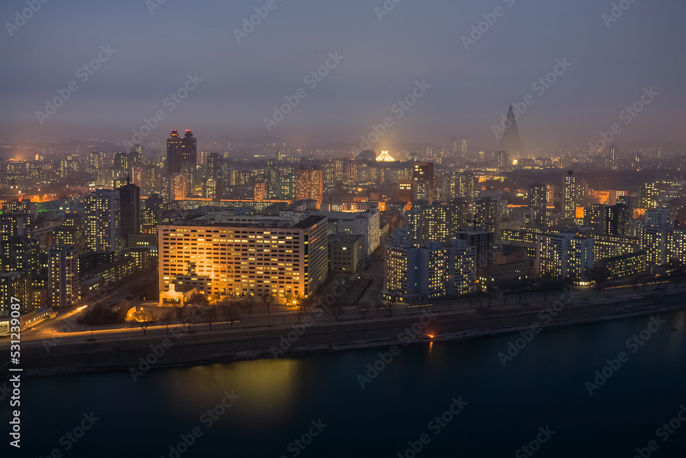 Pyongyang city skyline at night, Hotel Ryugyong silhouette and Taedong River, Democratic Peoples's Republic of Korea (DPRK), North Korea