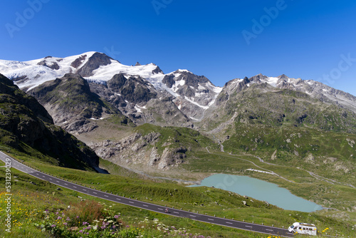 Beautiful scenic aerial view of mountain panorama at Swiss mountain pass Susten with glacier lake on a sunny summer day. Photo taken July 13th, 2022, Susten Pass, Switzerland.