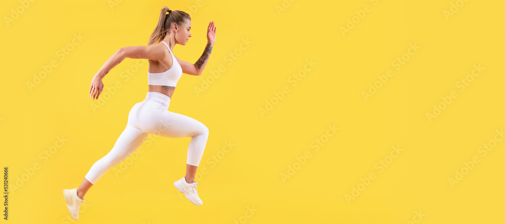 fitness woman runner running on yellow background. copy space. Woman jumping running banner with mock up copyspace.