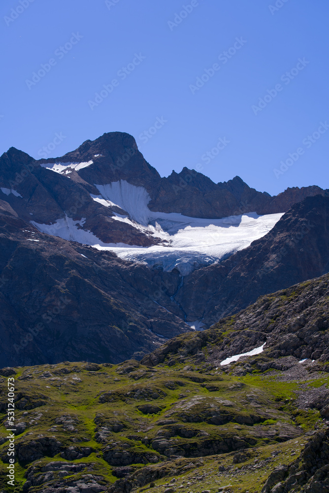 Obraz premium Beautiful scenic view of mountain panorama with Tschingelfirn Glacier at Swiss mountain pass Susten on a sunny summer day. Photo taken July 13th, 2022, Susten Pass, Switzerland.