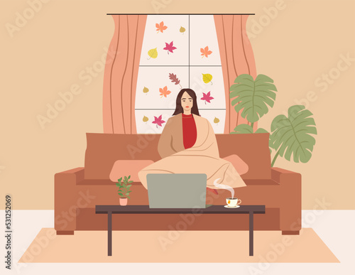 The girl is sitting on the couch and holding a laptop. Freelance and learning at home. Autumn interior room. Vector illustration