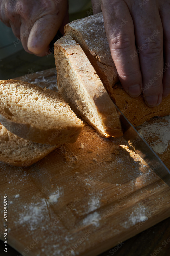 loaf of bread on a cutting board loaf of bread on a cutting board