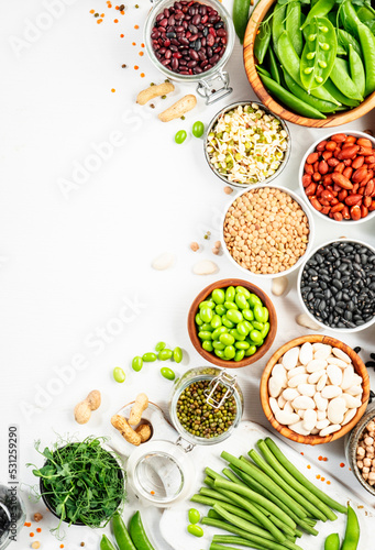 Beans, legumes and green sprouts. Dried, raw and fresh, top view. Red beans, lentils, chickpeas, soybeans. Healthy, nutritious, diet food, vegan protein, micronutrients and fiber sources photo