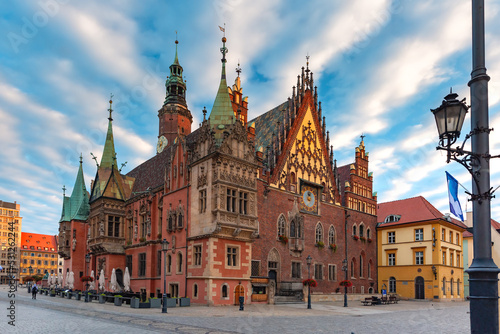 Multicolored traditional historical houses and City Hall on Market square at sunset  Old Town of Wroclaw  Poland