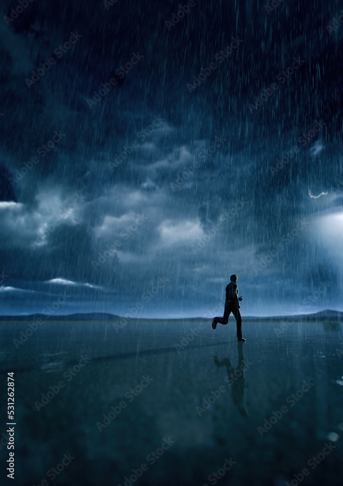 Man in black suit runs in rainy desert with a cloudy sky. 3D render.