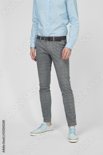 Grey men's luxury Classic suit trousers on model isolated on white background. Man wearing office checkered pants, shirt, autumn spring outfit. Top view. Template, mock up