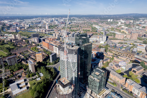 Valokuvatapetti Manchester City Centre Drone Aerial View Above Building Work Skyline Construction Blue Sky Summer Beetham Tower Deansgate Square Glass Towers