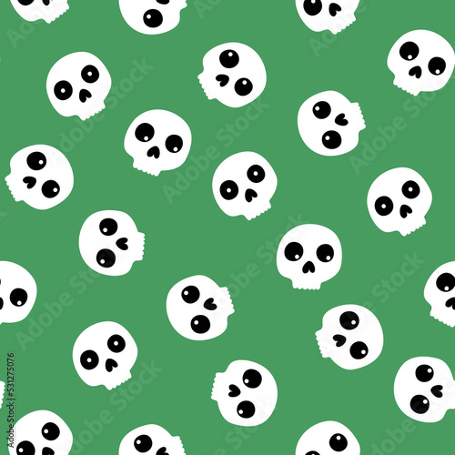 Halloween vector seamless pattern with skulls on the green background