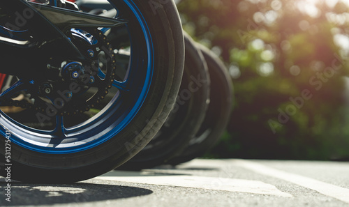 Wallpaper Mural Part of a motorcycle wheel, tire, parked on a beautiful road, has a copyspace area. Torontodigital.ca
