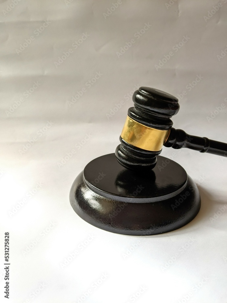Judicial hammer and wooden base on a white background Judicial hammer and wooden base on a white background