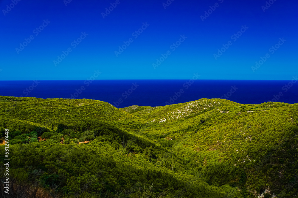 Fototapeta premium green hills with blue sea and sky