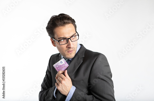 Принти на полотні Close-up photo of cunning businessman hiding pack of cash money in his jacket is