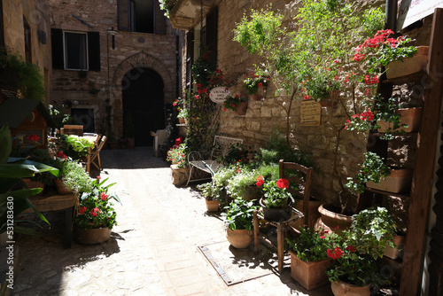 street in the medieval village of spello, umbria, italy