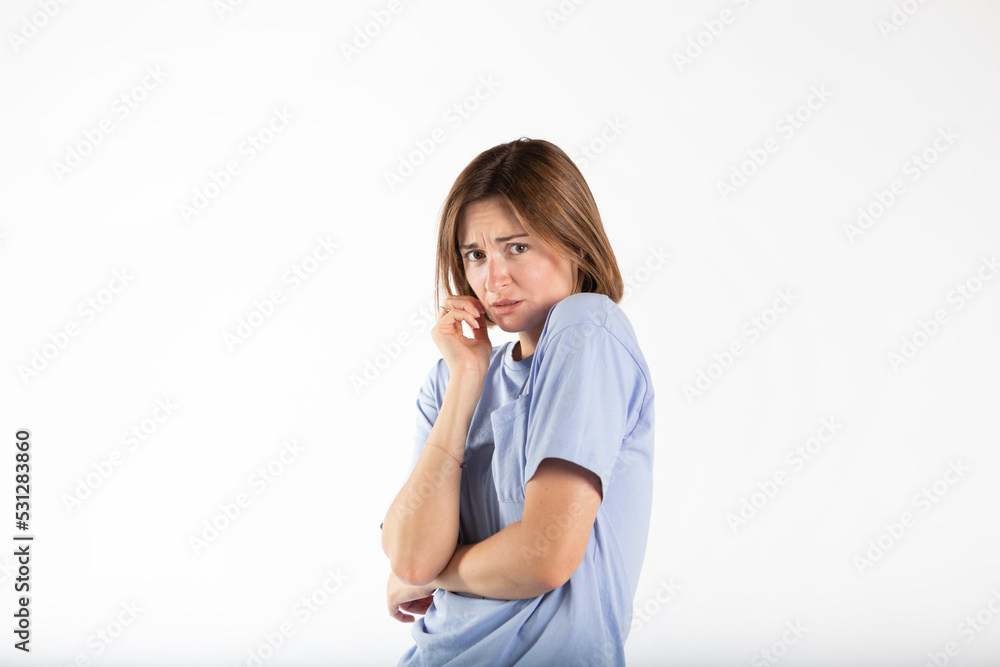 Close-up portrait of young panicking woman isolated on white background Close-up portrait of young panicking woman isolated on white background
