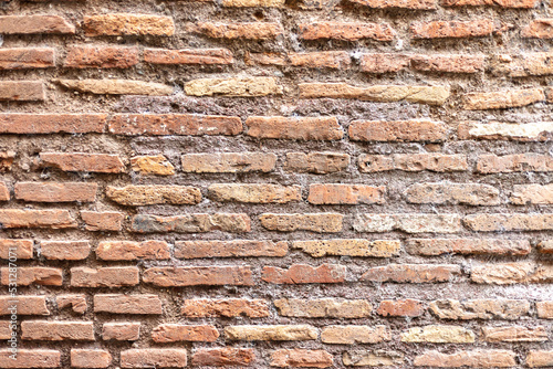red brick wall of old building as background
