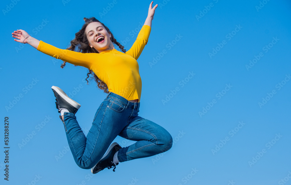 happy teen girl jump high on sky background. copy space happy teen girl jump high on sky background. copy space