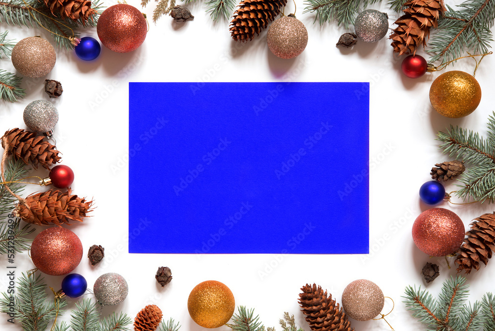 Christmas background with Christmas tree branches and  decorations on an isolated white background