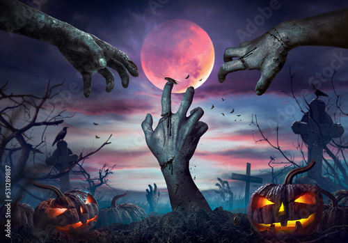 Obraz na plátně Zombie hand rising in dark Halloween night.