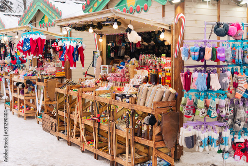 christmas market, winter holiday, new year's fair on a winter snowy street