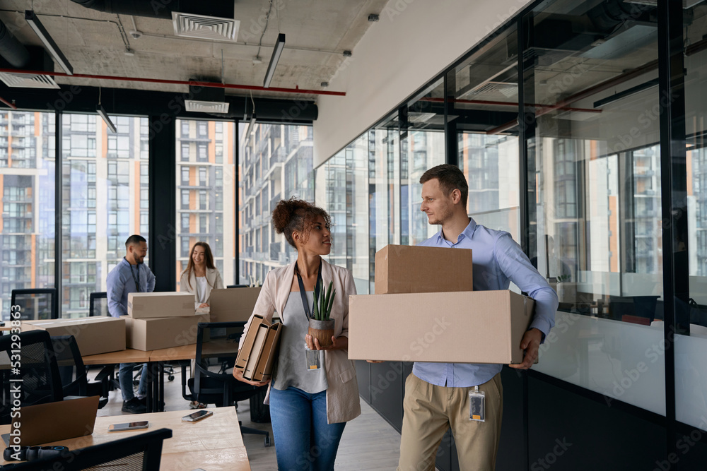 Young company employees preparing for office moving Young company employees preparing for office moving