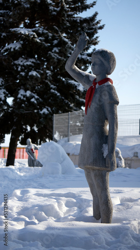 Sculptures of Soviet pioneers in the winter park. The history of pioneering in frozen sculptures.
