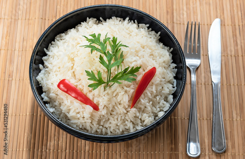 a bowl with rice, on a table