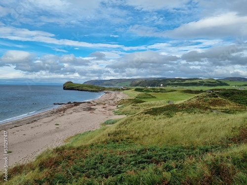 Fantastic view of a golf course near a beach in Cruden Bay, Scotland photo