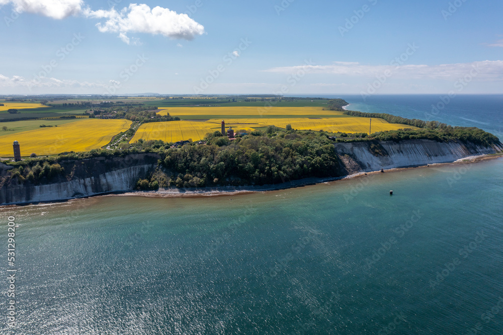The island Ruegen Germany with many rape fields and lighthouse