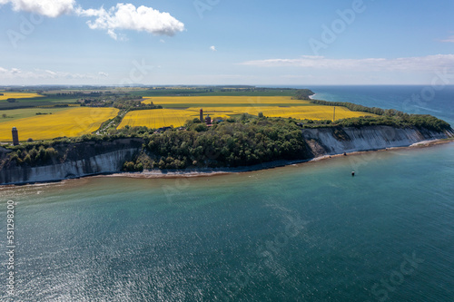 Obraz na płótnie The island Ruegen Germany with many rape fields and lighthouse w salonie