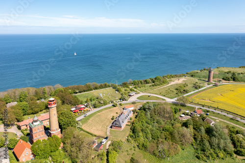 Obraz na płótnie The island Ruegen Germany with many rape fields and lighthouse w salonie